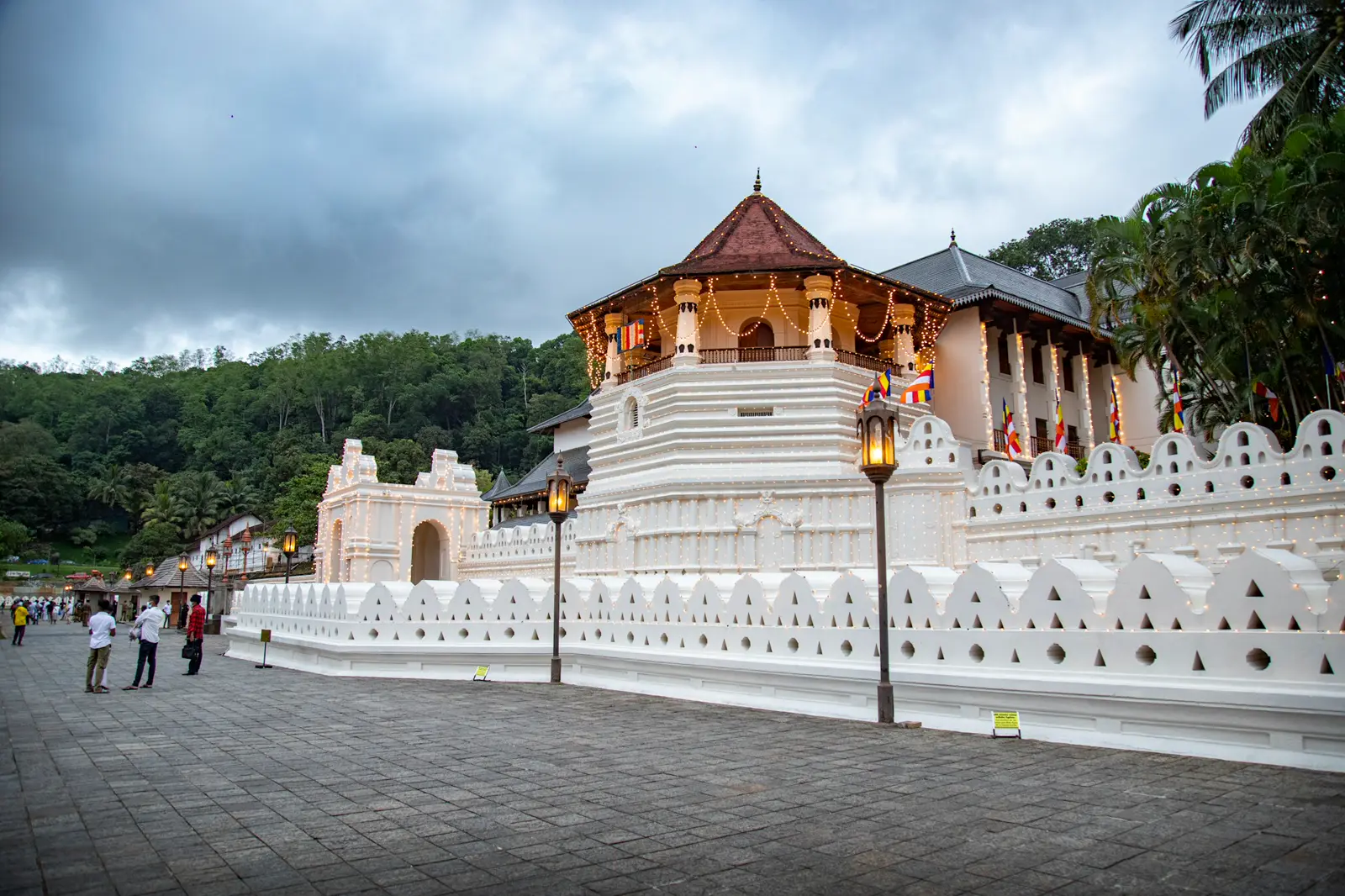 The Temple of the Sacred Tooth Relic in Kandy, its gold-roofed pavilion behind the white moat wall